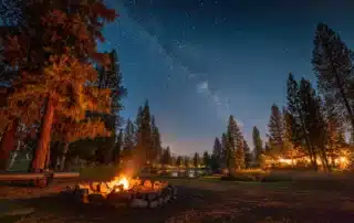 Family enjoying outdoor camping at a scenic campground in Bozrah Connecticut with tents and cabins surrounded by nature
