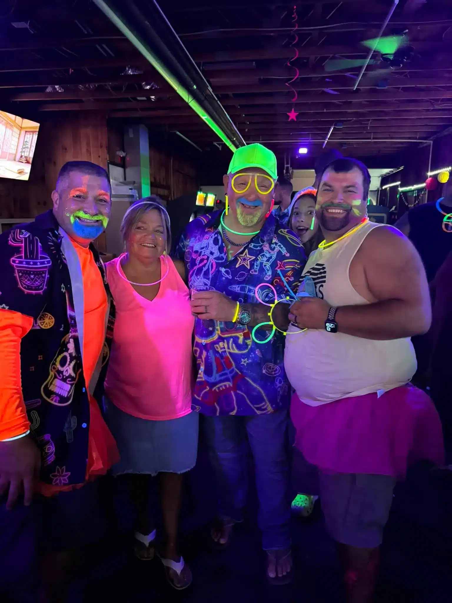 Group of campers enjoying neon weekend event in Acorn Acres Bozrah CT