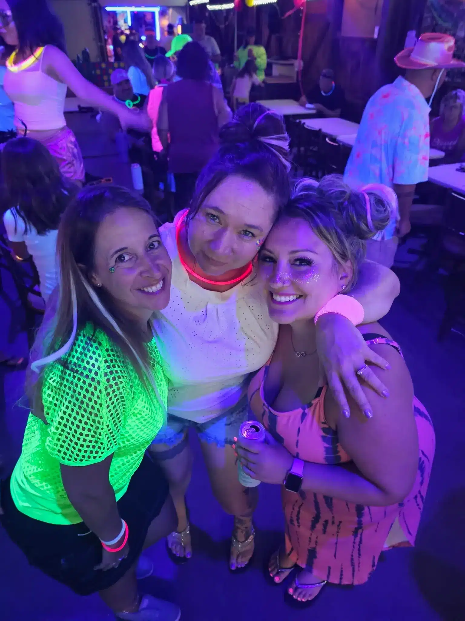 Friends enjoying a nighttime camping event at Acorn Acres in Connecticut