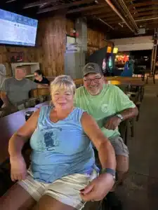 Friends gathering inside a Connecticut campground recreation hall
