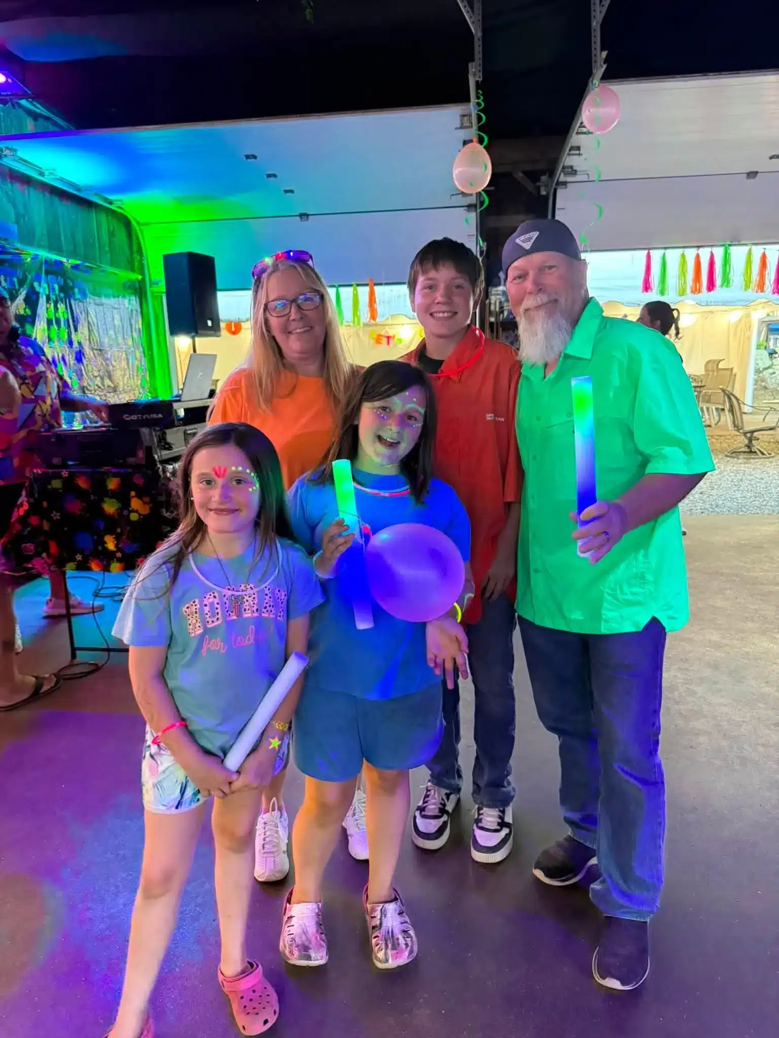Friends attending neon weekend event at Acorn Acres Campground in Bozrah Connecticut
