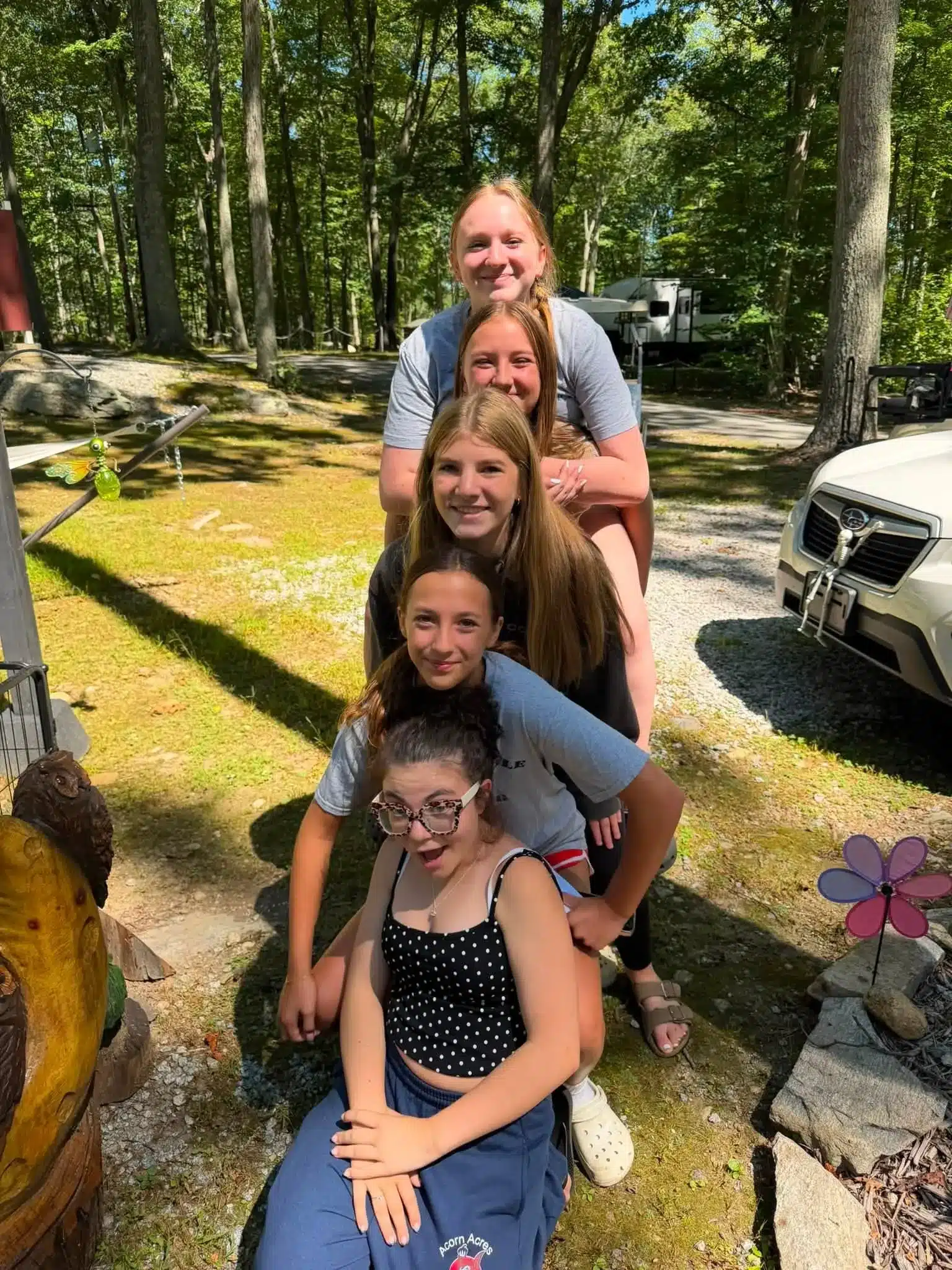 Family posing at a wooded RV campground in Bozrah CT