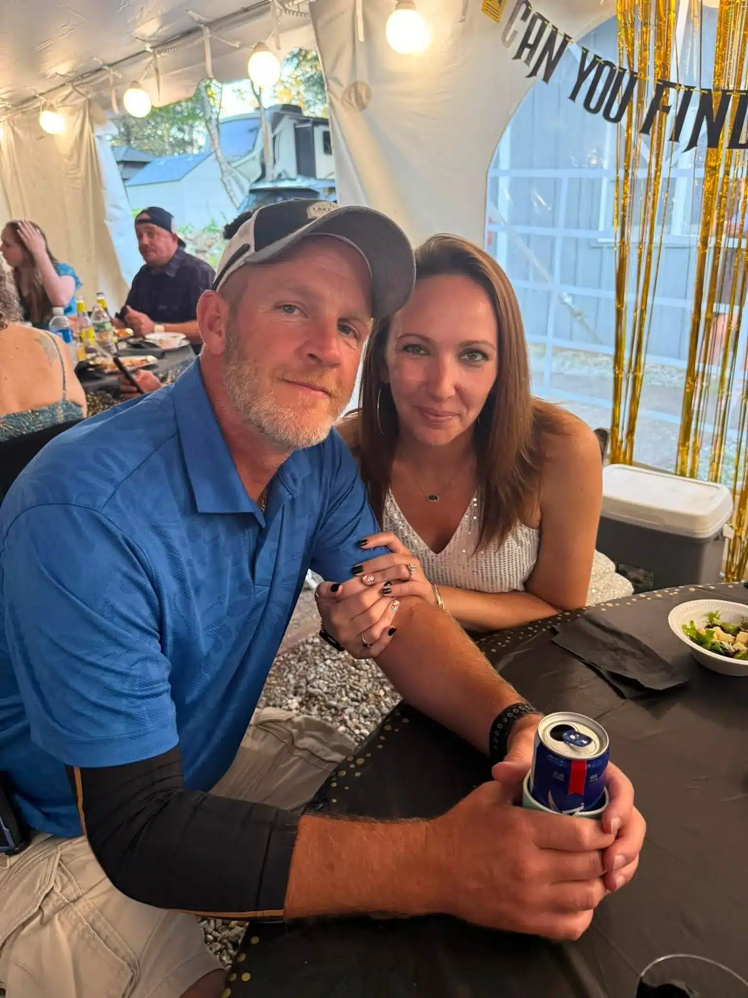 Couple enjoying an indoor campground event at Acorn Acres