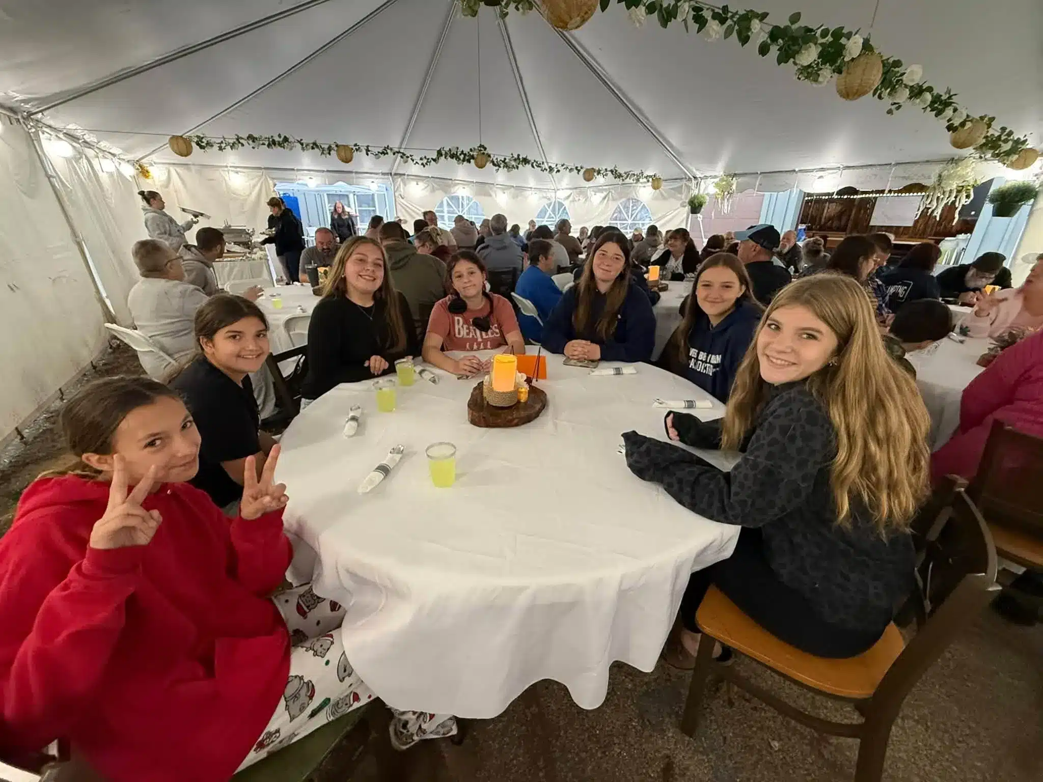 Children seated around a round table with a seasonal centerpiece at Acorn Acres Campground in Bozrah, CT